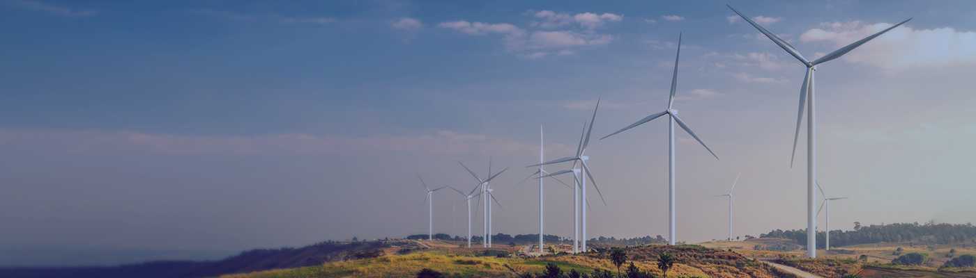 Landscape image of Windmills representing Wolfspeed's commitment to sustainability